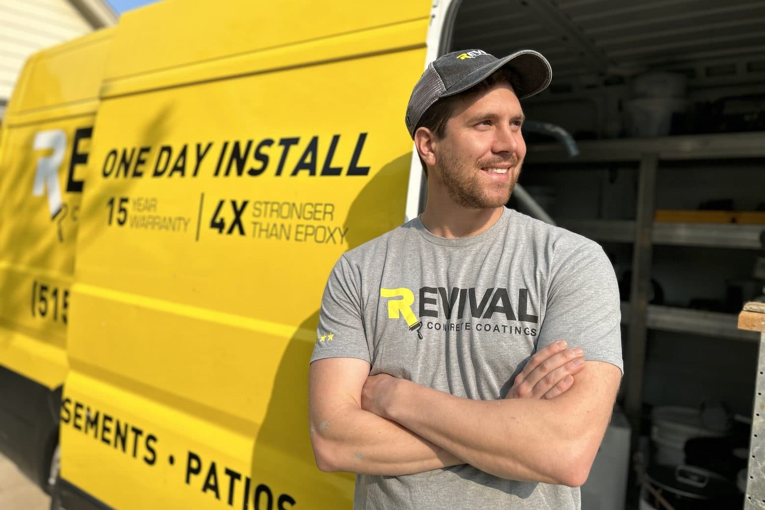 Jack Forsman, founder of PolySurface Marketing, in front of a Revival Concrete Coatings van